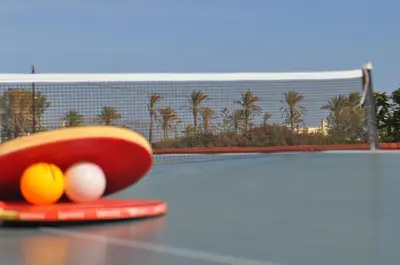 a tennis racket and balls on a tennis court at Villa Imerti Kiotari in Kiotari