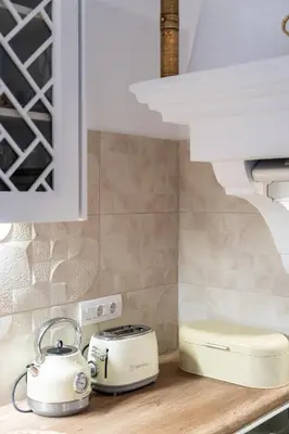 a white toaster sitting on a counter in a kitchen at Villa Antonis in Halki
