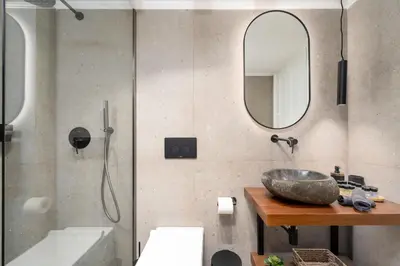 a bathroom with a sink and a shower with a mirror at Villa Antonis in Halki
