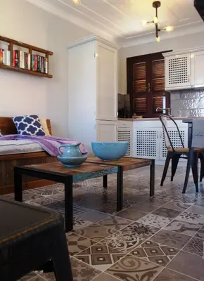 a living room with two bowls on a table at Halkis Muses in Halki