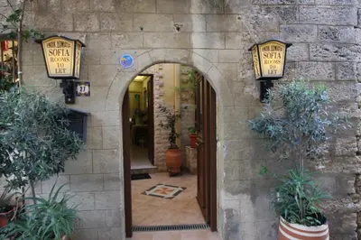 an archway in a building with potted plants at Sofia Pension in Rhodes Town