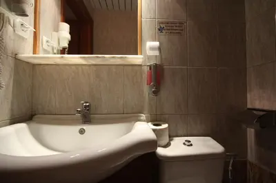 a bathroom with a sink and a toilet at Sofia Pension in Rhodes Town
