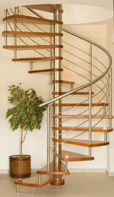 a metal spiral staircase with a potted plant at Blue Dream Luxury Villas in Pefki Rhodes