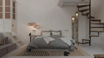 a bedroom with a bed and a staircase in it at Aelia mini villa in Líndos