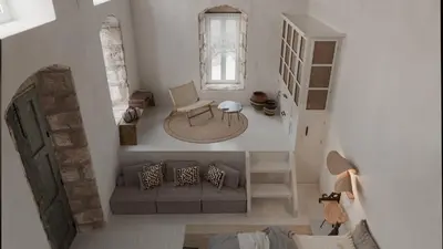 an overhead view of a living room with a couch and a chair at Aelia mini villa in Líndos