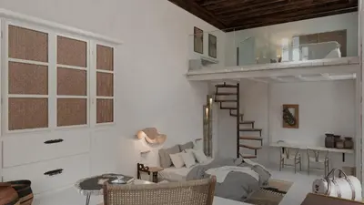 a living room with a spiral staircase and a couch at Aelia mini villa in Líndos