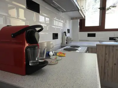 a kitchen counter with a red toaster on a counter top at Kathopouli Apartment in Rhodes Town