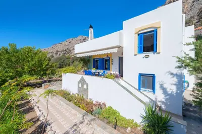 a white house with a hill in the background at Villa Lia Panorama in Pefki Rhodes