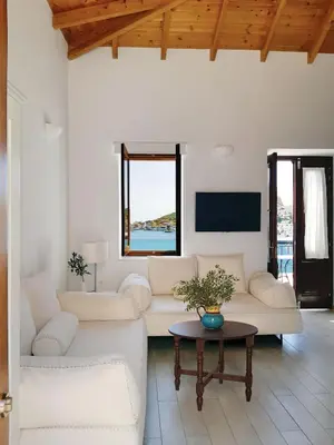 a living room with a couch and a table at Aegean View Villas in Halki