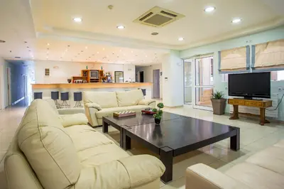 a living room with a couch and a coffee table at Mon Repos Hotel in Faliraki