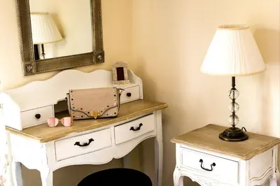 a dressing table with a lamp and a mirror at Lindos Luxury Retro Villas in Líndos