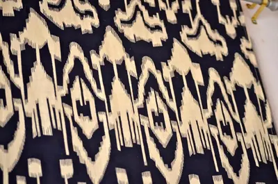 a black and white animal print skirt on a bed at Lindos Esel Suites in Líndos
