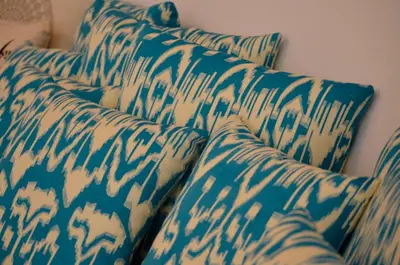 two blue and white pillows sitting next to each other at Lindos Esel Suites in Líndos
