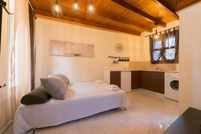 a bedroom with a white bed in a room at The old town Neighbourhood in Rhodes Town
