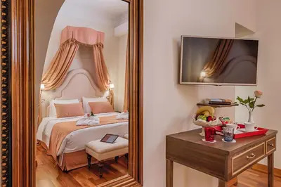 a bedroom with a large mirror and a bed at Sperveri Boutique Hotel in Rhodes Town