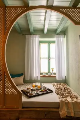 a room with a bed with a tray of food on it at Sperveri Boutique Hotel in Rhodes Town