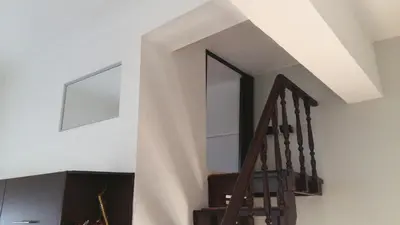 a staircase with a window and a stair case at Amazing apartment 300 meters from the Old Town in Rhodes Town