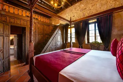 a bedroom with a large bed in a room at S.Nikolis' Historic Boutique Hotel in Rhodes Town
