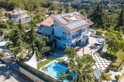 an aerial view of a house with a swimming pool at Athina's Villa with heated pool in Koskinou