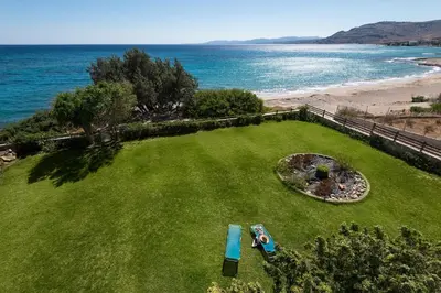 an aerial view of a yard with a view of the ocean at Villa Sole Mare in Pefki Rhodes