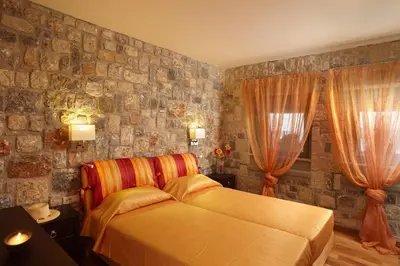 a bedroom with a bed and two windows at Blue Dream Exclusive villas privees in Pefki Rhodes