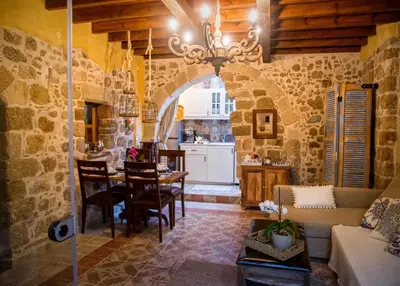 a living room with a table and a dining room at George & Alexandra's Apartments in Rhodes Town