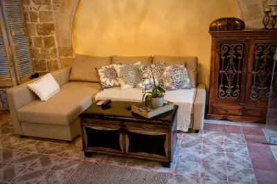 a living room with a couch and a table at George & Alexandra's Apartments in Rhodes Town