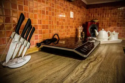a kitchen with a counter with knives on a counter top at George & Alexandra's Apartments in Rhodes Town
