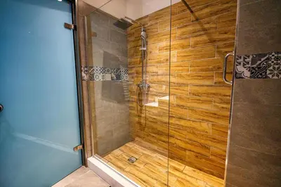 a shower with a glass door in a bathroom at Island Boutique Hotel in Rhodes Town