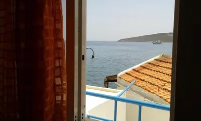 a view from a window of a boat in the water at Spiros Apartments in Livadia