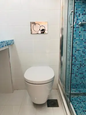a bathroom with a toilet and a glass shower at Carpe Diem Studios in Ialyssos