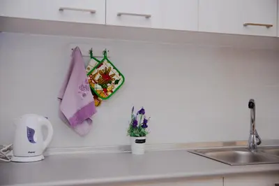 a kitchen counter with a sink and a towel at St Peter & Paul at haraki in Haraki