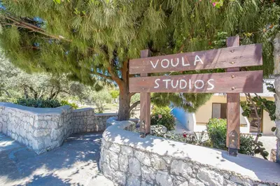 a wooden sign that reads you a studio at Voula Studios in Faliraki