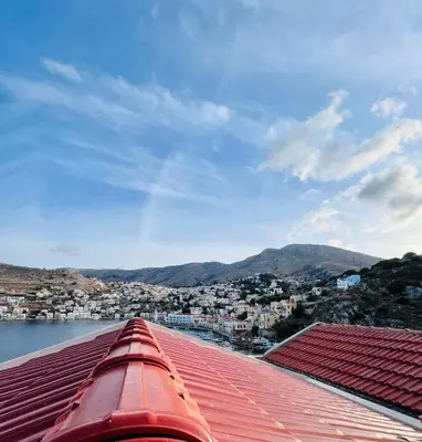 a view of a city from the roof of a building at Kleanthi and Kostas Studios in Symi