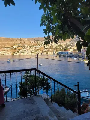 a view of a body of water with a city at Kleanthi and Kostas Studios in Symi