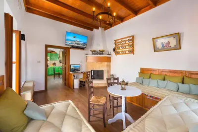 a living room with a couch and a table at Villa Eftihia in Lindos in Líndos