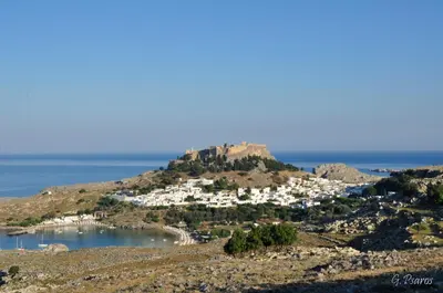 a small town on a hill near the ocean at Villa Eftihia in Lindos in Líndos