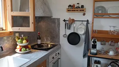 a kitchen with two bowls of fruit on a counter at Ktima Natura in Archangelos