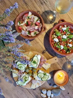 a table with a plate of food and a bowl of food at Ktima Natura in Archangelos