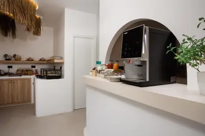 a kitchen with a counter top with a microwave at Stay Helios in Faliraki