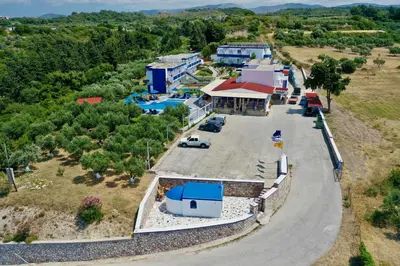 an aerial view of a house with a parking lot at Summer View in Theologos