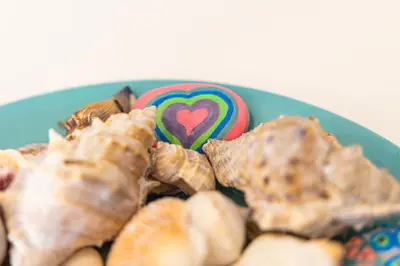 a blue plate of food with a heart cookie at Haraki Village in Haraki