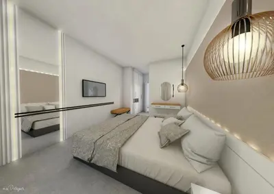 a bedroom with a large bed and a tv at Atlantis Boutique City Hotel in Rhodes Town