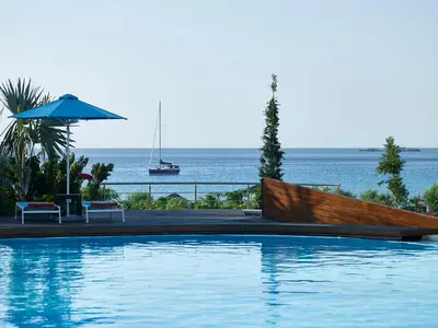 a swimming pool with a view of the ocean at Aquagrand Artistic Luxury Beach Resort - Adults Only in Líndos