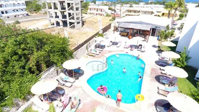 an overhead view of a swimming pool at a resort at Sevastos Studios in Faliraki