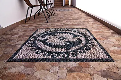 a spiral rug on the floor of a hallway at Lindos Panorama in Líndos