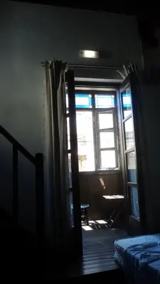 a room with a door open to a room with a window at Domus Studios in Rhodes Town