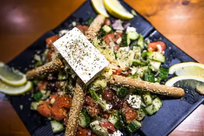 a plate of food on a table with food on it at Manousos City Hotel in Rhodes Town