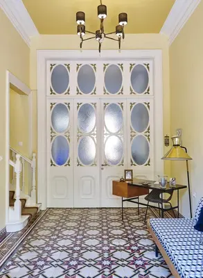 a room with a white door with a table at Villa Sanyan - Adults Only in Rhodes Town