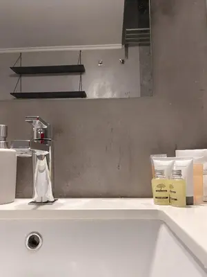 a bathroom with a white sink and a mirror at Villa Sanyan - Adults Only in Rhodes Town
